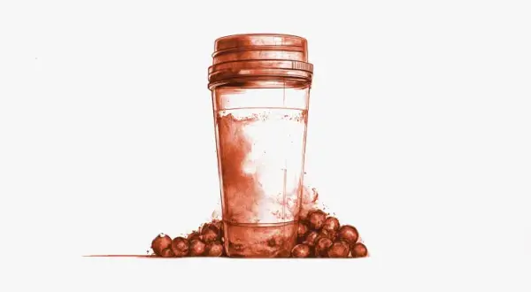 Un vaso con polvo y bayas, ideal para saber cuándo tomar BCAA y potenciar tu entrenamiento.